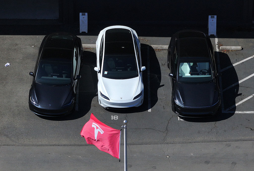 Tesla cars parked at a dealership
