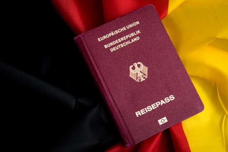 138487952 german passport on flag of federal republic of germany 138487952 german passport on flag of federal republic of germany