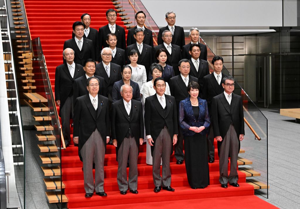 Japanese Prime Minister Fumio Kishida (front-center) poses with new cabinet members at his official residence after new cabinet reshuffle, keeping in place some most influential members in Tokyo, Japan, on Sept. 13, 2023.