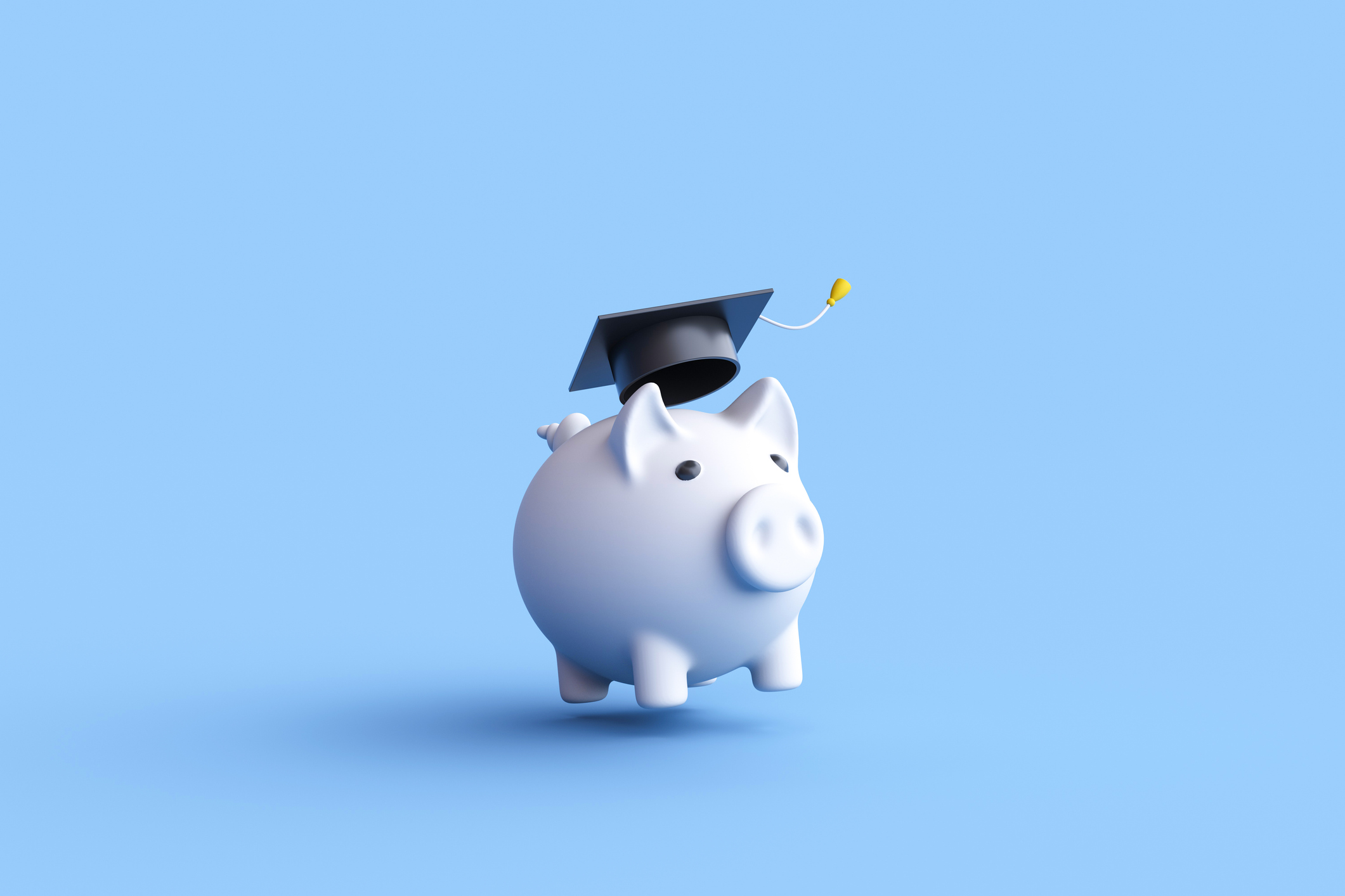 Piggy bank with graduation cap