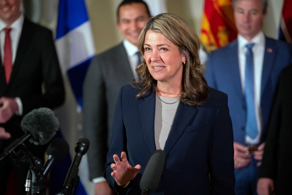 Premier of Alberta Danielle Smith, accompanied by other Council of the Federation members, speaks to reporters at the Mayflower Hotel in Washington, Feb. 12, 2025.