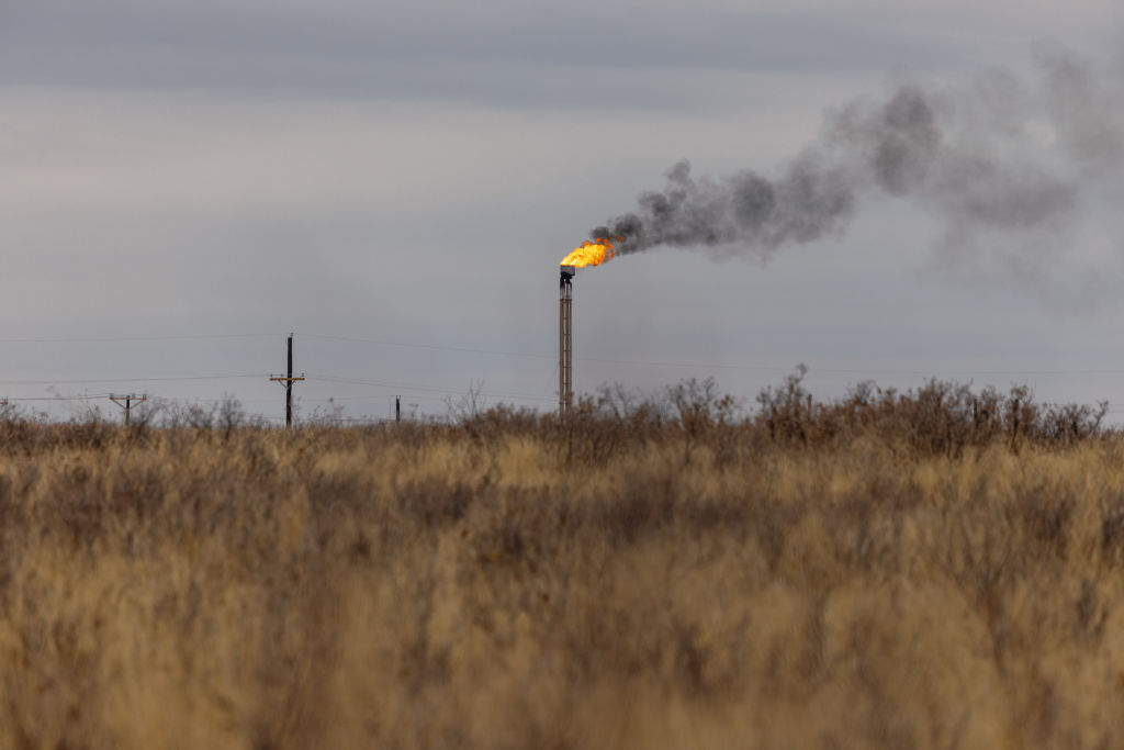 A natural gas flare stack at an oil well in Midland, Texas, U.S. on April 4, 2022. 