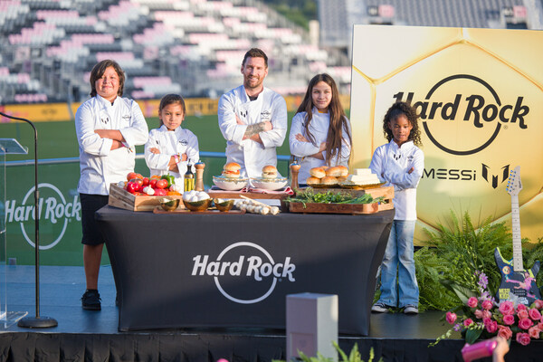 Hard Rock International and global brand ambassador, Leo Messi, announce their first-ever Messi menu for kids, “The Hard Rock Messi Kids Menu,” with help from Seminole Tribe of Florida and local South Florida community kids during the launch event at DRV PNK Stadium on October 2. (AJ Shorter / Hard Rock International)