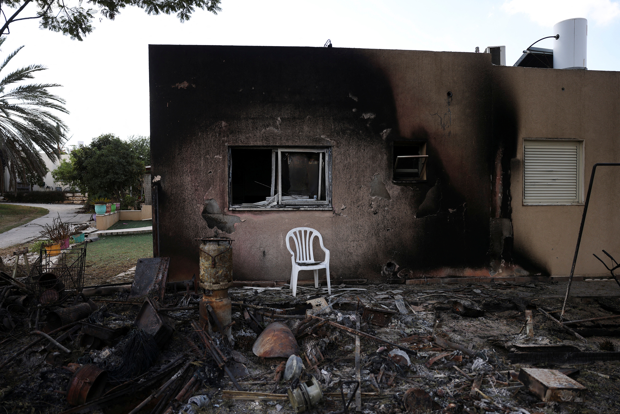 The remains of a burnt house following a deadly infiltration by Hamas gunmen, in Kibbutz Kfar Aza in southern Israel, Oct. 15.