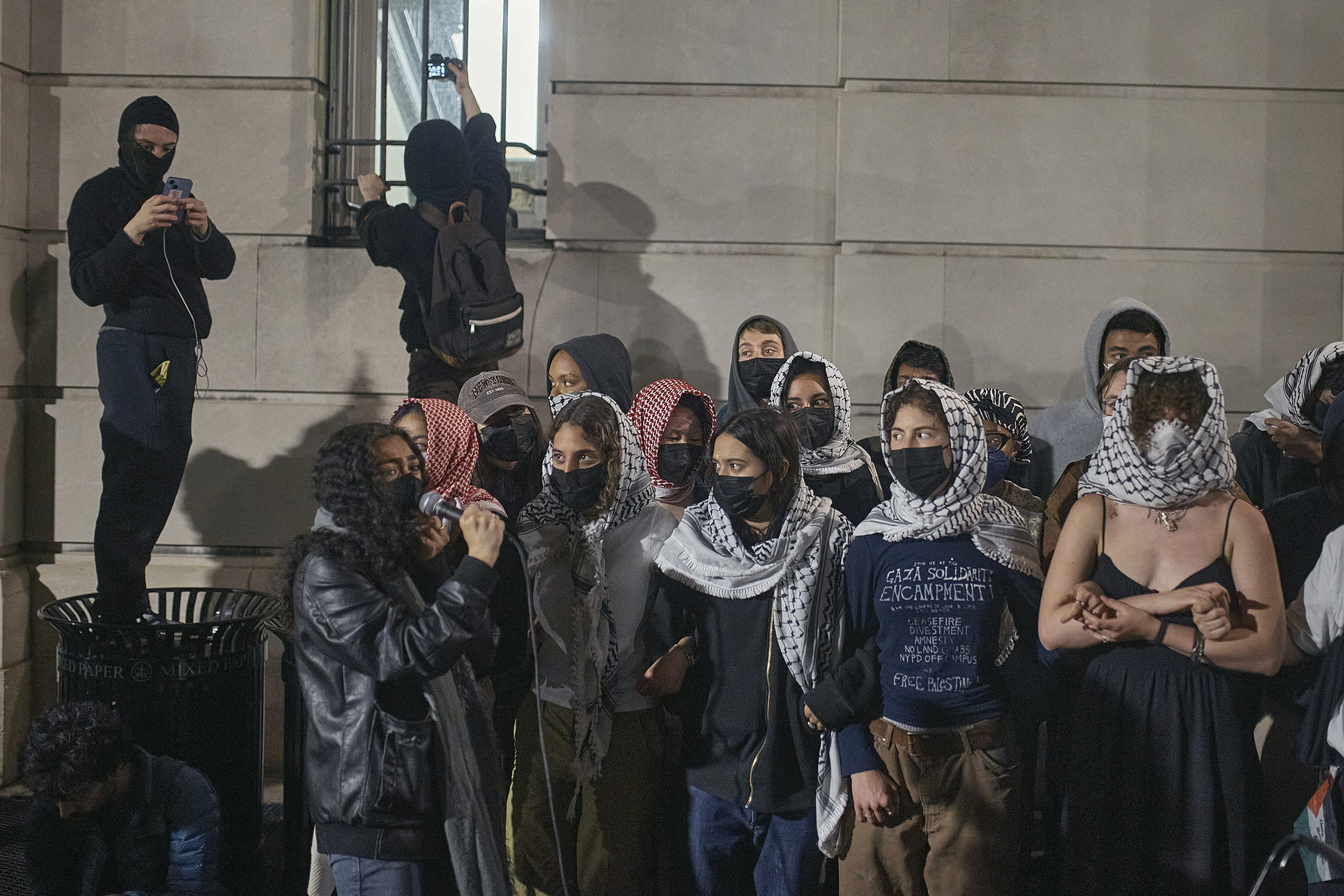 Protestors block Hamilton Hall as they take over the interior of the building on Columbia University campus during a pro-Palestinian encampment, on April 29, 2024.