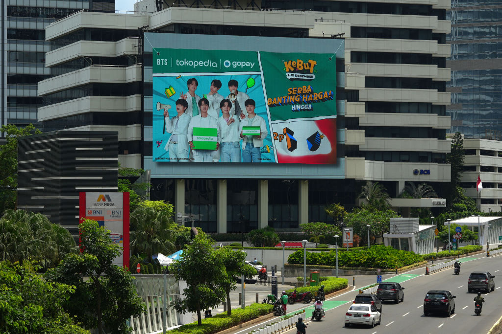 A digital advertisement for Tokopedia and Gopay featuring K-pop band BTS on a building in Jakarta, Indonesia, on Dec. 12, 2022
