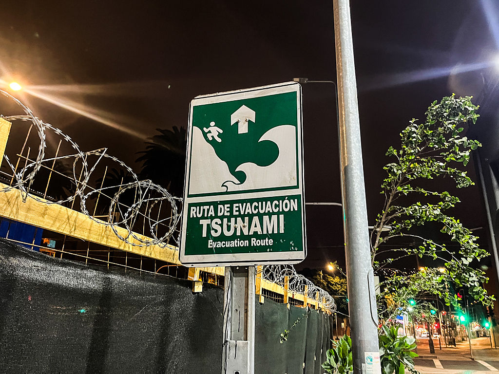 A sign of a Tsunami Evacuation Route is seen. Due to an