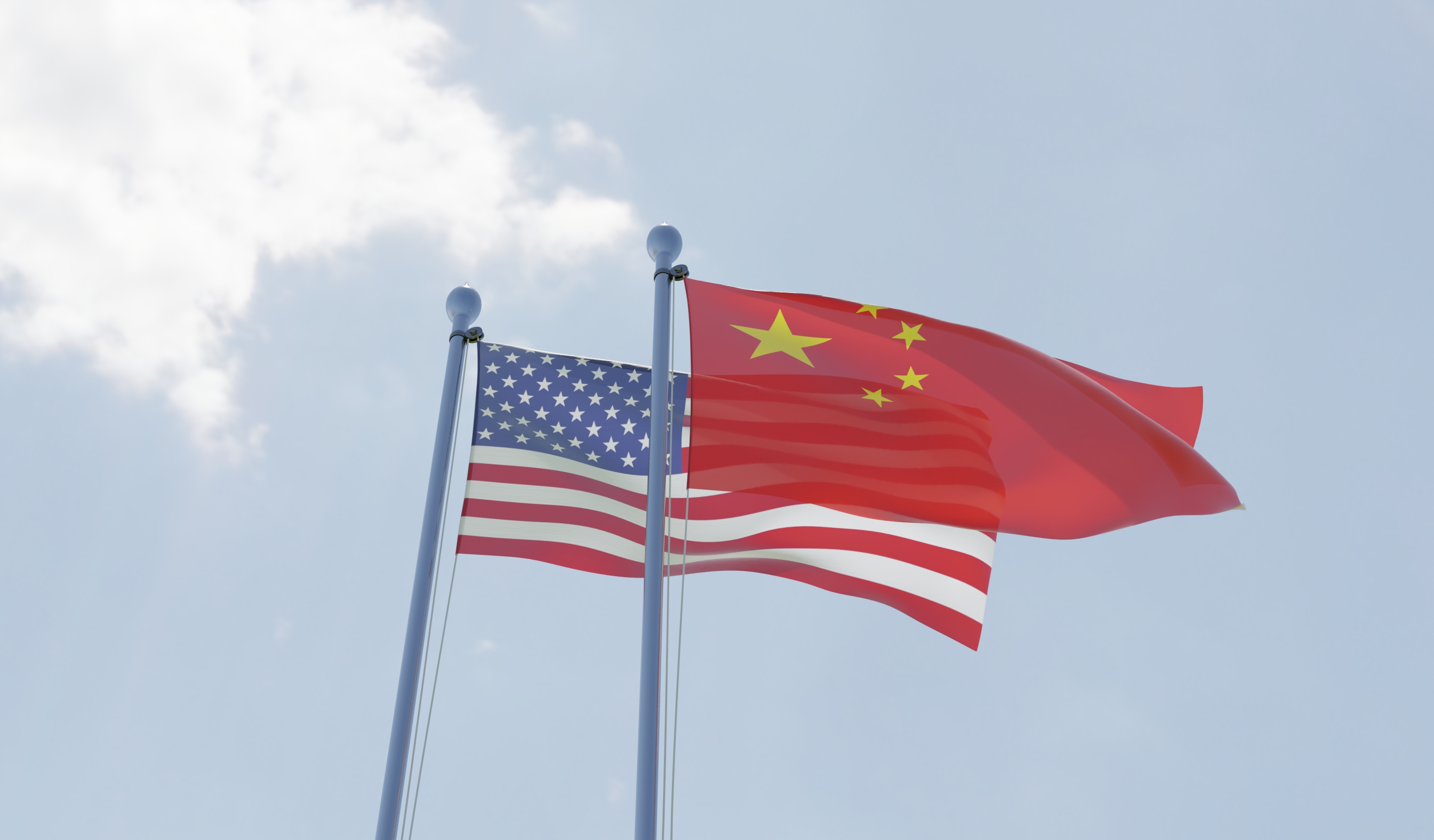 China and USA, two flags waving against blue sky