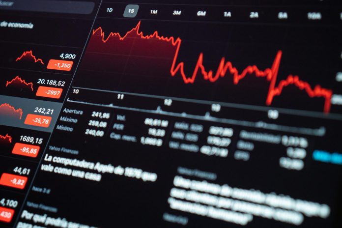 screen showing data about financial crisis because coronavirus e1704238441840 Apple's Slide Leads Tech Stocks Lower, S&P 500 Retreats as 2024 Begins