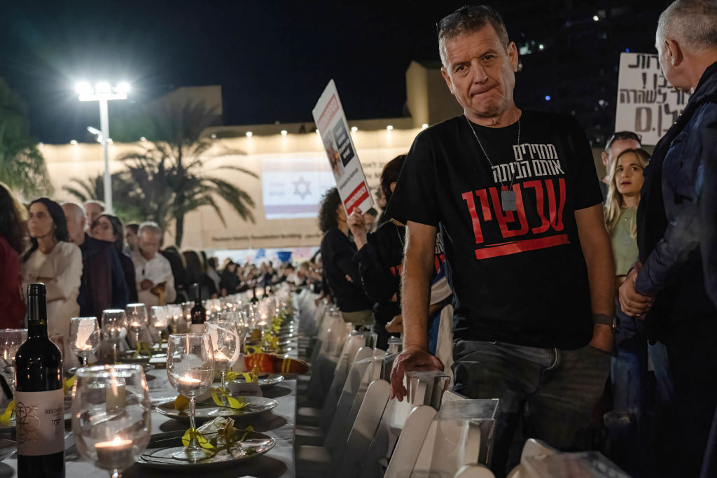 A protester seen wearing a T-shirt with a slogan supporting