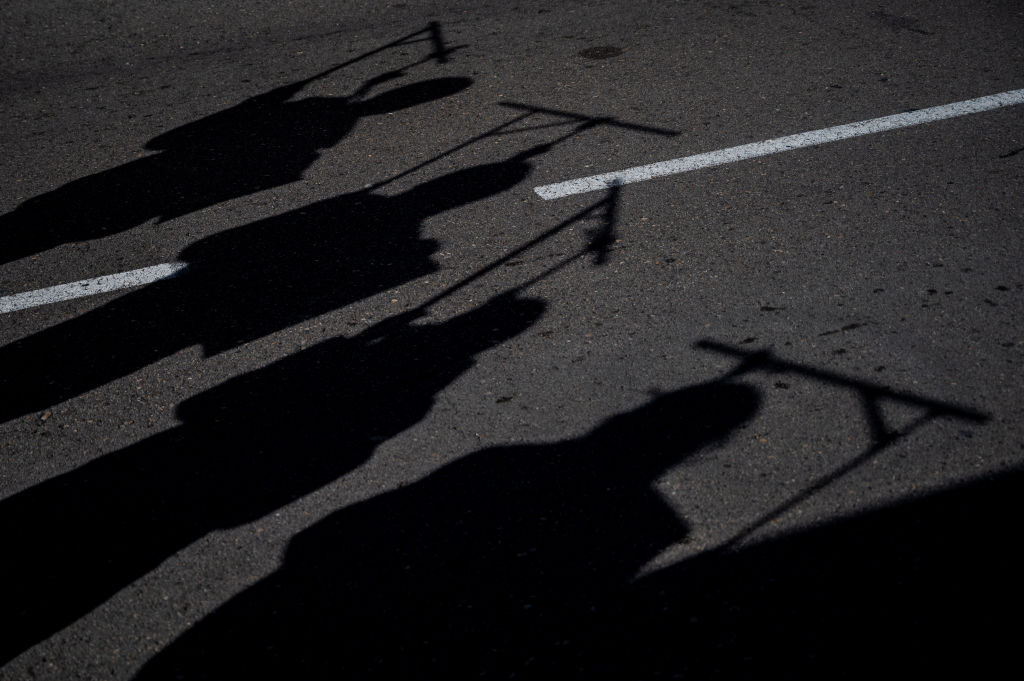 Silhouettes of hanged people are seen during a demonstration