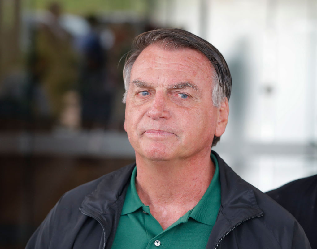 Brazil's ex-President Jair Bolsonaro arrives at Brasilia airport on March 25, 2025.