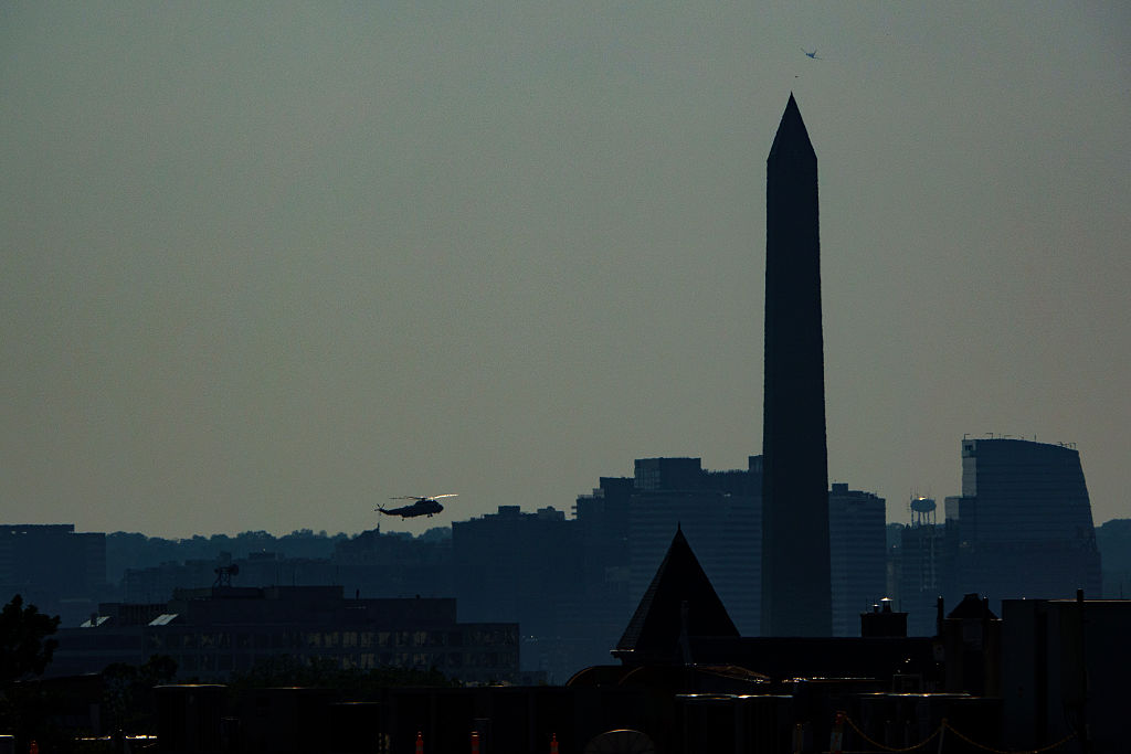 Marine One, carrying U.S. President Donald Trump flies by the Washington Monument while returning to the White House in Washington, D.C., on June 21, 2025.