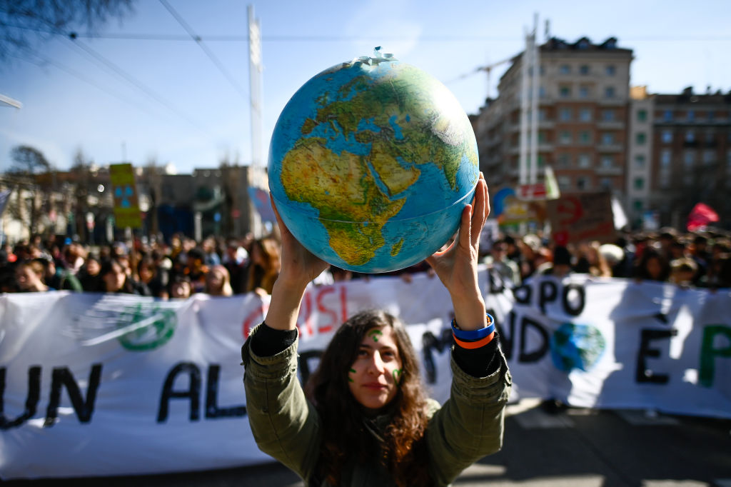 Protester holds a small globe during the global climate strike on March 3, 2023 in Turin, Italy. 