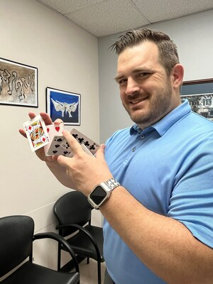 Dr. Philip Miller shows off his card tricks.