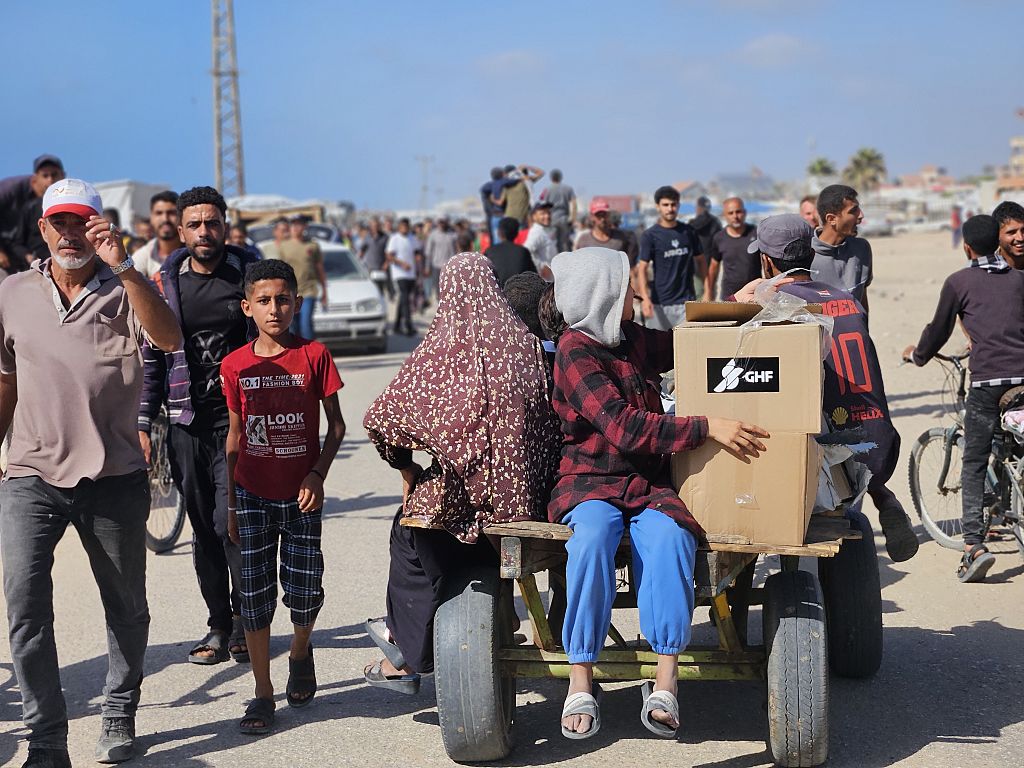 Thousands of Palestinians flock to aid distribution point in southern Gaza