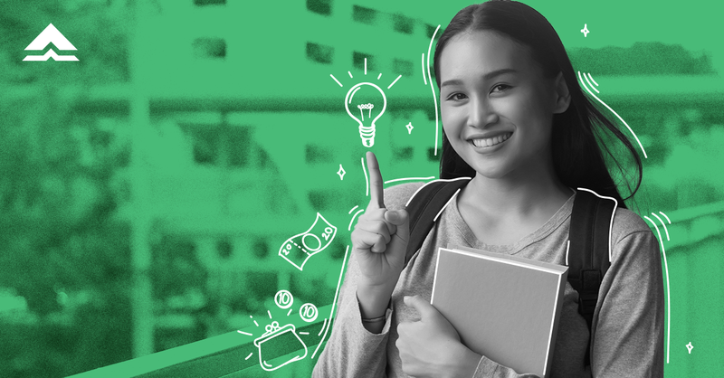 Girl student smiling and holding a book