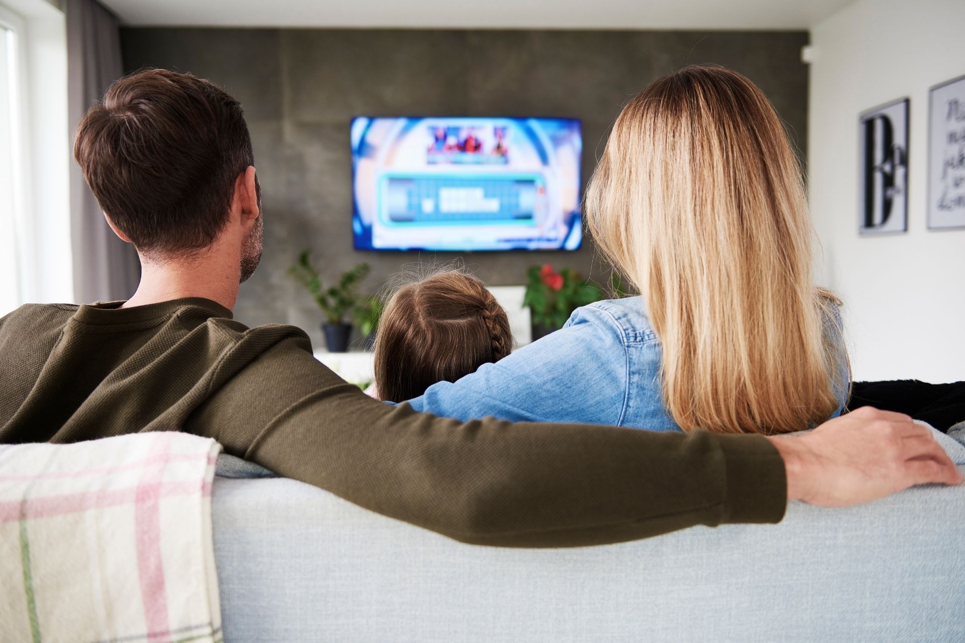 How can property-wide TV content curation contribute to revenue generation for the property?