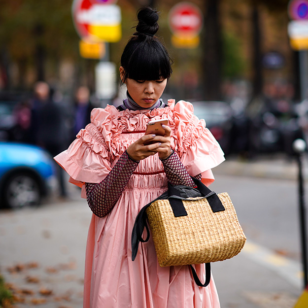 Susie Lau with a straw bag