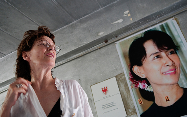 Birkin in front of a portrait of Aung San Suu Kyi during a four-day trip to the Thai-Burma border, where she visited several organisations and projects