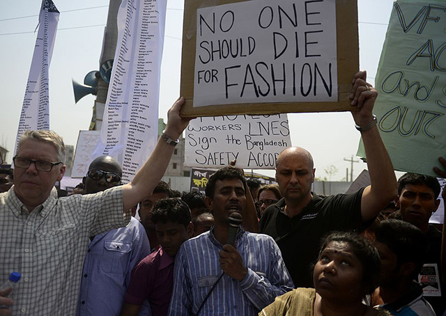 Bangladeshi activists and relatives of the victims of the Rana Plaza building collapse take part in a protest marking the first anniversary of the disaster at the site where the building once stood.