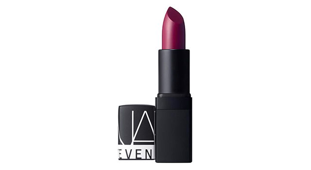 A deep burgundy lipstick adds the right amount of seductive drama to the monochromatic outfit.