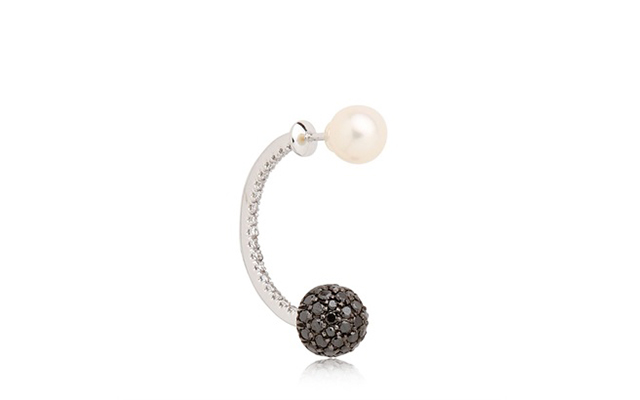 A little asymmetry never hurt anyone and a single earring in white gold, black and white diamonds and a pearl is a pretty great way to make a statement.