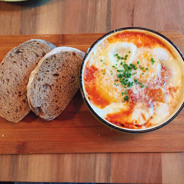 The Metal Box Baked Eggs with tomatoes and chunks of potatoes, eggplant, cannellini beans and chicken