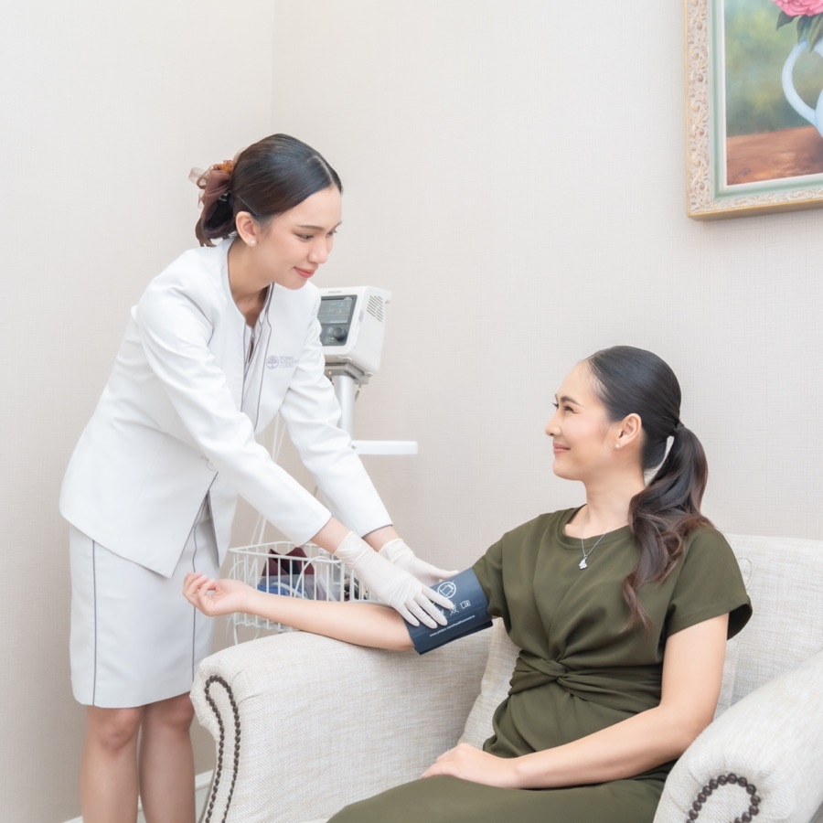Blood pressure check during a preventive health assessment at BDMS Wellness Clinic, Bangkok