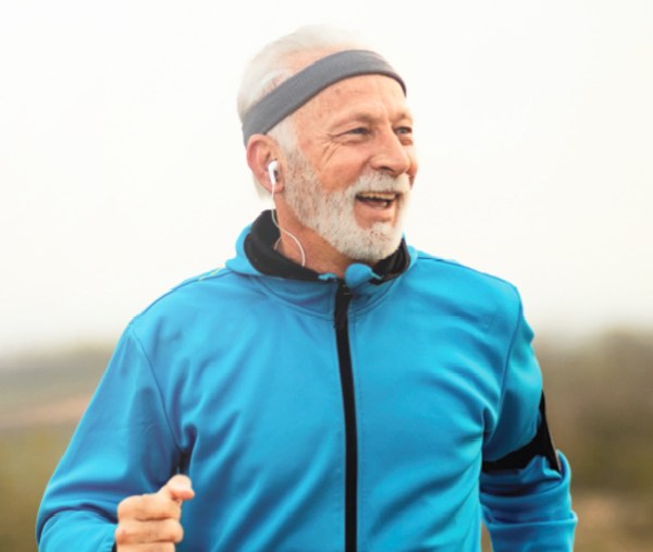 Active senior man jogging outdoors — Longevity Centenarian 100 Blueprint, BDMS Wellness Clinic Bangkok