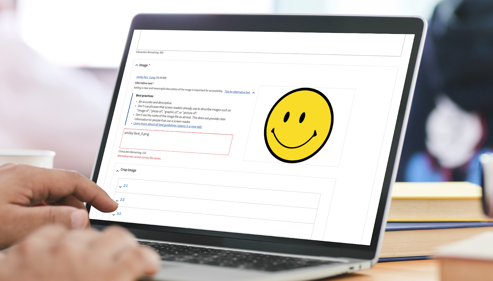 An image of a smiley face is displayed to show an example of inputting alt text on a VA website