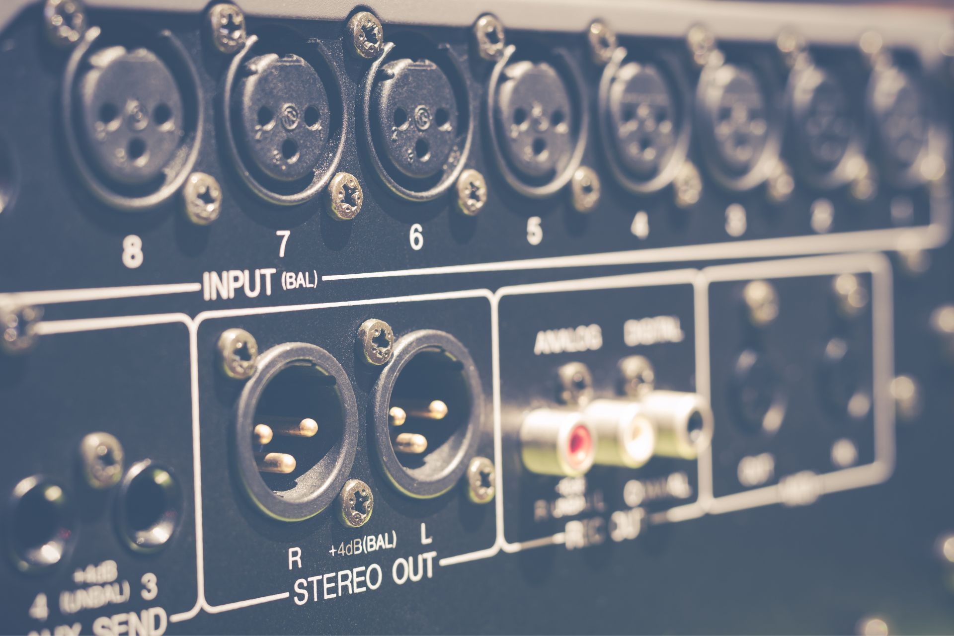 What type of cables and connectors are commonly used in a sound system setup?