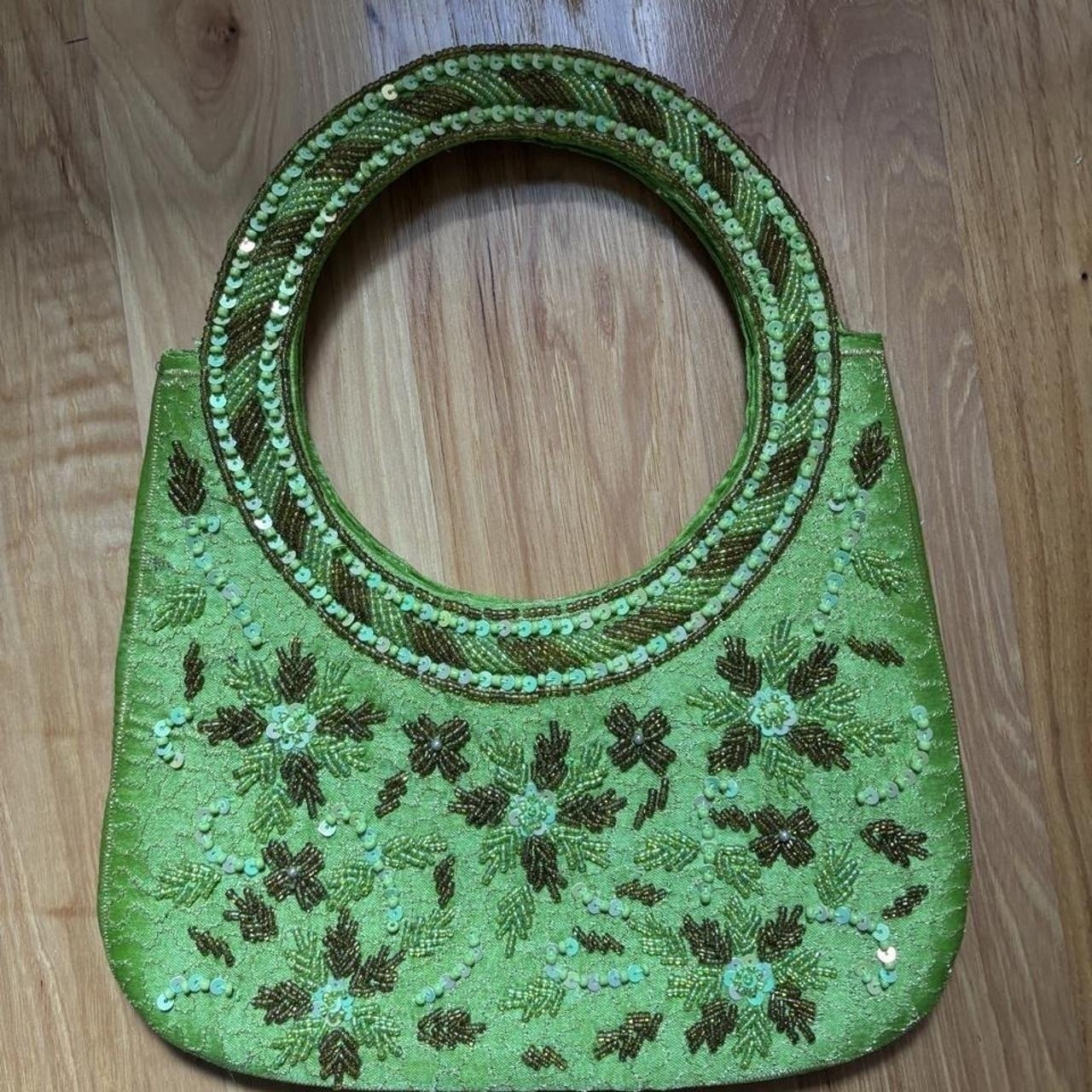 Green beaded handbag with brown floral embroidery...