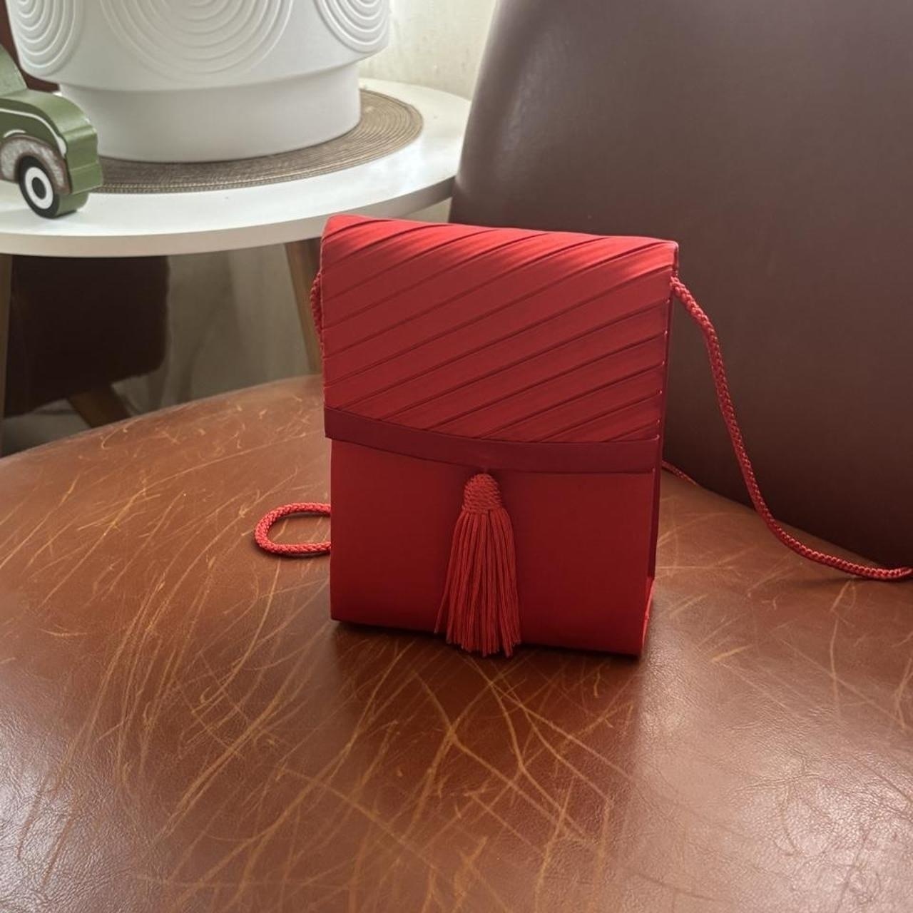 Red mini crossbody bag with diagonal pleats ...