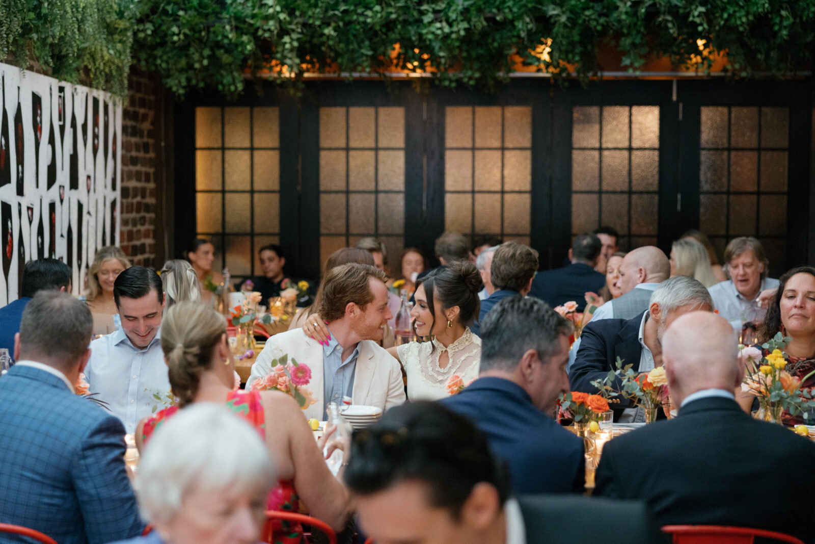 a crowd of people sitting at a restaurant