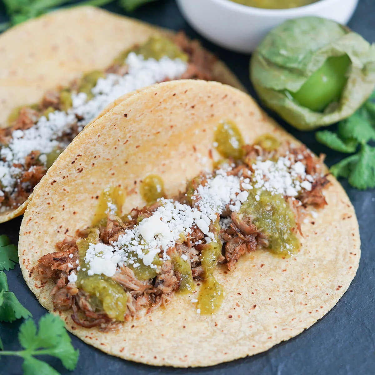 Pork carnitas tacos with tomatillo salsa verde