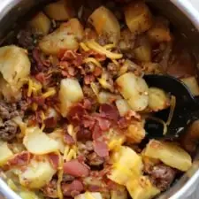 Gratinado de ternera, patata y ranchera con queso