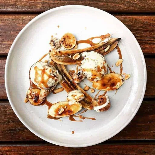 Hot cross bun & olive oil ice cream w/ bruleed bananas and salted caramel