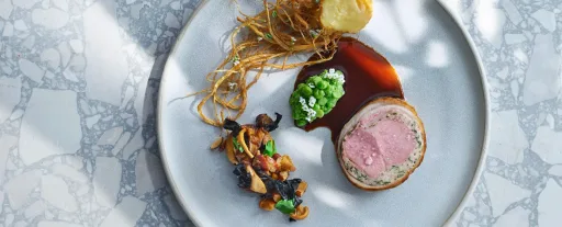 Herb-stuffed saddle of lamb with butter-roasted celeriac