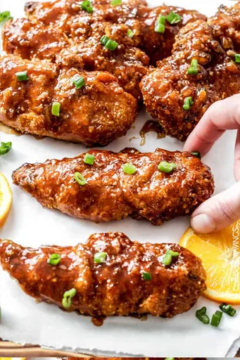 Tenders de poulet à l’orange sucrés et épicés au four