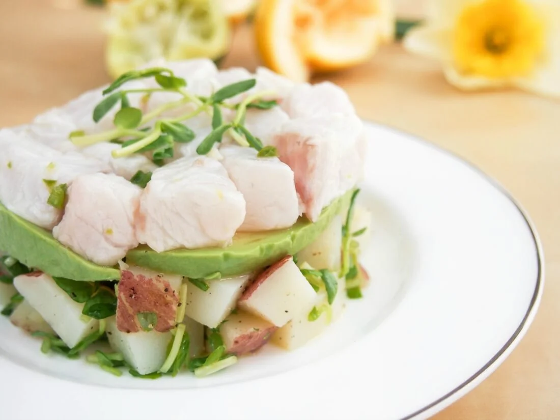 Ceviche with potato and pea shoot salad