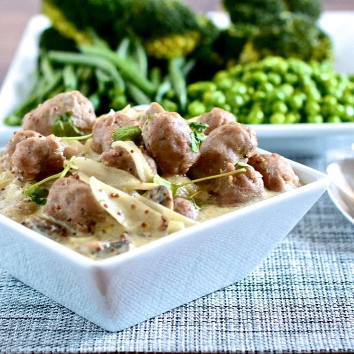 Sausage and mushrooms in mustard and cider