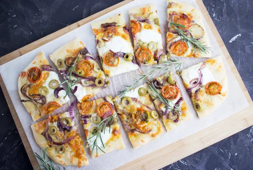 Flatbread with cheese, tomato, rosemary and olives