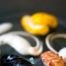 Pan-seared Langoustine, Saffron Monkfish, Squid Ink Tagliatelle