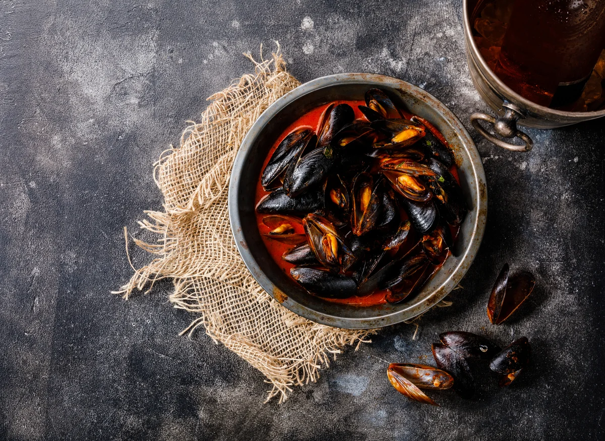 Mussels Cooked in Tomato Sauce With Lemon Zest, Wine and Herbs