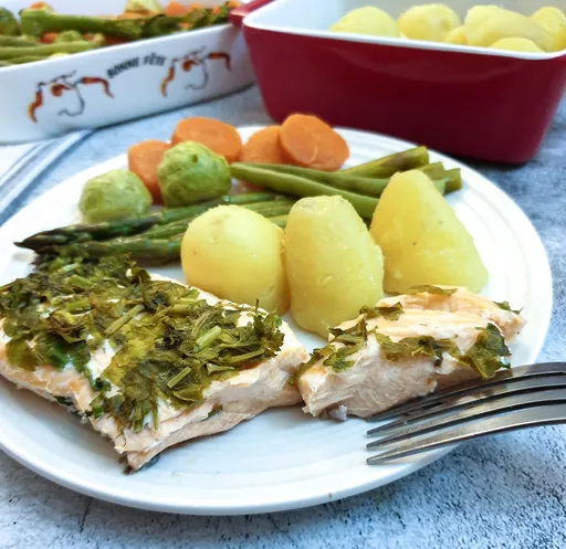 Herb and butter salmon and asparagus parcels with lemon