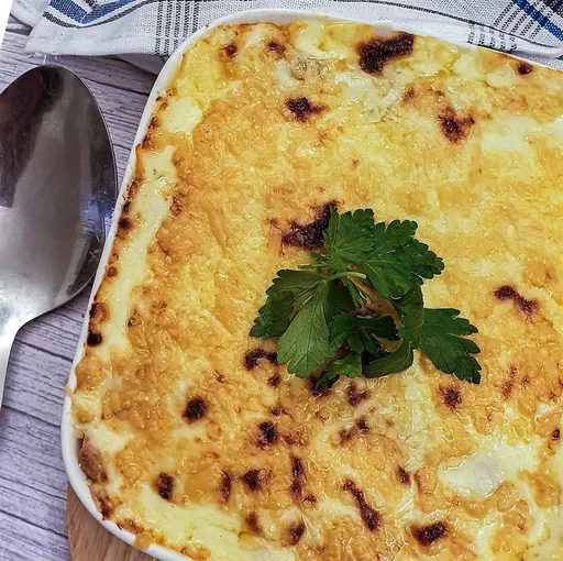 Savoury minced stuffed pancakes with meat sauce and cheese