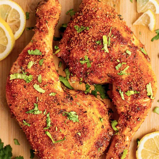 Cuartos trasera de pollo en freidora de aire