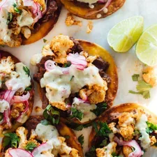 Cauliflower Black Bean Tostadas with Queso and Pickled Onion