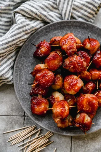 Castañas de agua envueltas en tocino (inspirado en el rumaki)